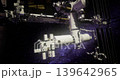 Astronauts conduct repairs on the International Space Station, surrounded by the stunning backdrop of a star filled universe in low Earth orbit during a spacewalk. 139642965
