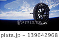 A futuristic space station orbits Earth, showcasing its intricate design against the backdrop of the blue planet and distant stars. The scene captures the serenity of space exploration. 139642968