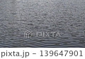 Video of gentle ripples spreading across the surface of a lake 139647901