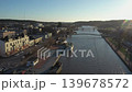 Porvoo.Finland-December 12.2020: Awesome drone shot of the historical architecture and the river in Porvoo Finland on a sunny day. Aerial shot with the camera slowly moving forward. 139678572