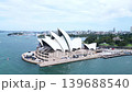 Drone aerial footage of the Sydney Opera House and the surrounding coastal cityscape. 139688540
