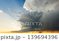 Spinning supercell thunderstorm moving closer across severe weather sky 139694396