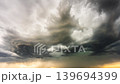 Massive storm clouds flowing across the sky in severe weather time lapse 139694399