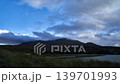 Time-lapse of candy floss clouds over the mountains. Shot during daytime with some amazing mountains in the backdrop. High quality Full HD footage 139701993