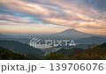 A sunset view of Mt. Fuji and flowing clouds from Shindo Pass. 139706076