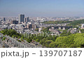 A fixed-point photograph showing the view of Takatsuki city in Osaka Prefecture from a mountain. 139707187