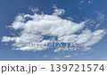 A magnificent scene of clouds slowly spreading across the summer blue sky. 139721574