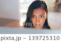 Closeup, business and Indian woman in office, success and online reading for data analysis, social media and email. Zoom, female employee and consultant with ideas, inspiration and project feedback 139725310