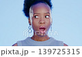 Black woman, studio and wow face by background for news, event and gossip in confused portrait. Gen z model, young african and surprise with facial shock, notification and emoji by blue backdrop 139725315
