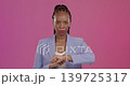 Upset, late and black woman with a watch in a studio checking the time with disappointment. Mad, annoyed and portrait of African female model with a schedule or deadline isolated by purple background 139725317