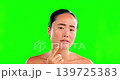 Asian woman, face and squeeze pimple on green screen in skincare for dermatology against studio background. Portrait of female with facial breakout, blackhead or grooming for acne treatment on mockup 139725383