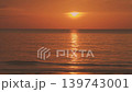 Witness the magic of a Thai evening: vibrant red tones paint the sky as the setting sun reflects on the tranquil surface of the iconic Andaman Sea. High quality 4k footage 139743001