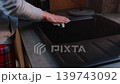 Hand Cleaning Black Kitchen Sink With Cloth, close up household video frame showing modern faucet, countertop and daily home care 139743092