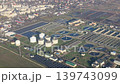 Aerial View Of Wastewater Treatment Plant And Urban District, industrial video frame with circular tanks, reservoirs and solar panels 139743099