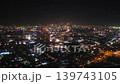 Dubai night skyline with Burj Khalifa and city lights, aerial urban video frame showing glowing roads and skyscrapers 139743105