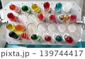 Colorful test tubes in a lab show various liquids used for experiments in a science facility 139744417