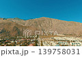 Aerial drone view of rocky desert mountain landscape near Palm Springs California under bright blue sky and sunlight 139758031