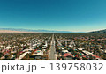 Wide aerial panorama of Palm Springs California with desert neighborhoods roads and distant mountain landscape 139758032
