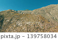 Close aerial view of rocky Palm Springs mountain terrain with dry desert textures and detailed natural formations 139758034