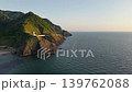 The white lighthouse standing on the rugged rocky mountain is the Kakuda Cape Lighthouse in Niigata City. 139762088