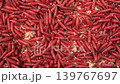 Red maggot worms crawl and move on a surface in a close-up view during daytime 139767697