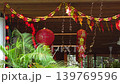 Traditional red Chinese lantern with golden decorative characters meaning fortune happiness and prosperity in English. Festive hanging ornament used during Chinese celebration. 139769596