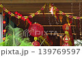 Traditional red Chinese lantern with golden decorative characters meaning fortune happiness and prosperity in English. Festive hanging ornament used during Chinese celebration. 139769597