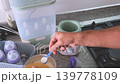 Father preparing and warming a baby bottle 139778109