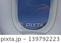solo travel and transportation concept with see city and beautiful sky from airplane window 139792223