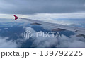 solo travel and transportation concept with see city and beautiful sky from airplane window 139792225