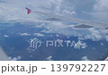 solo travel and transportation concept with see city and beautiful sky from airplane window 139792227