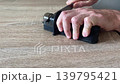knife sharpener grinds and scrapes when sharping a steel knife 139795421