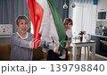 Happy multi generation family waving Italian flag together at home during soccer match 139798840