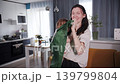 Happy mother and daughter celebrating favorite football team victory at home 139799804