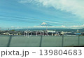 Scenic POV view of Mount Fuji from the window of a Tokaido Shinkansen bullet train in Japan. This video captures a spring trip from Osaka to Tokyo in April.  139804683