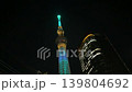 Tokyo Skytree broadcasting and observation tower illuminated at night in Tokyo, Japan. Low angle shot looking up at the illuminated modern tower against the dark night sky. 139804692
