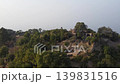 Tilla jogian aerial orbit circling ancient ruined domed shrines on hilltop peak surrounded by forest pakistan 139831516