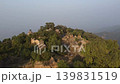Orbit view of domed temple ruins hidden in forest at Tilla Jogian Pakistan 139831519