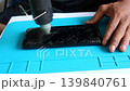 Technician Repairing Cracked Smartphone Screen With Heat Gun 139840761