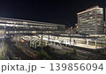 Trains stopped at the platform and Shinkansen bullet trains passing through Shin-Osaka Station at night. 139856094