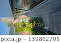 Thailand, Phuket, the edge of the swimming pool in a luxury villa, with a coconut palm and the sea in the background on a sunny day 139862705