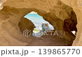 Hidden Coastal Archway Overlooking Turquoise Sea 139865770