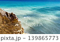 Turquoise Sea Meets Rugged Coastal Rock Cliffs 139865773