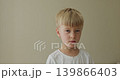 Child shows feelings, Young male exhibiting spectrum of thoughts and feelings, Youthful face conveying various inner sentiments and conceptual expressions 139866403