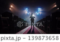 Man Putting on Motorcycle Helmet on Stage Moving Camera Back 139873658