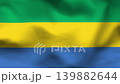 Gabon flag on wavy fabric, top view. Realistic textile texture with green, yellow, and blue horizontal stripes 139882644