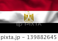 Egypt national flag on wavy fabric, top view. Realistic textile texture with red, white, and black stripes and the golden Eagle of Saladin 139882645