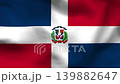 Dominican Republic flag on wavy fabric, top view. Realistic blue, red, and white panels with the central coat of arms 139882647