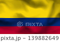Colombia flag on wavy fabric, top view. Realistic textile texture with yellow, blue, and red horizontal stripes in a clean flat lay. 139882649