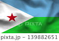 Djibouti flag on wavy fabric, top view. Blue and green stripes with a white triangle and red star on realistic textile. 139882651